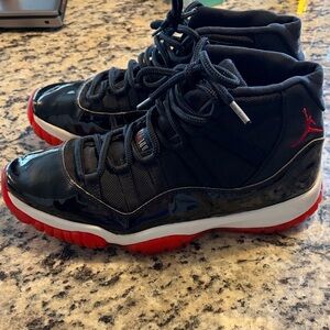 Air Jordan 11 Retro Bred Black and Red High Top Sneakers